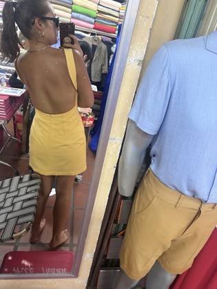 Clothes made at “Ms. An” No. 90 Tailor Inside Hoi An Cloth Market, photo by a customer (v c)
