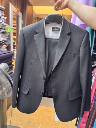 Clothes made at Thaicom, photo by a customer (Milan Ly)